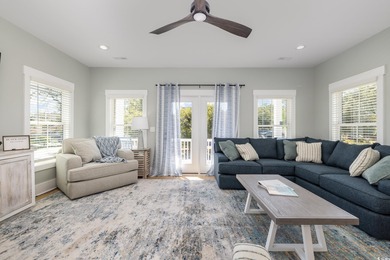 Just a quarter mile from the beach, this stunning 5-bedroom, 5