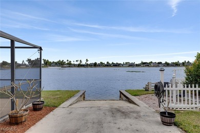 Welcome to a truly rare Cape Coral waterfront estate located on