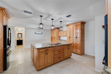 Welcome to a truly rare Cape Coral waterfront estate located on