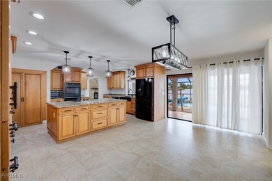 Welcome to a truly rare Cape Coral waterfront estate located on