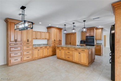 Welcome to a truly rare Cape Coral waterfront estate located on