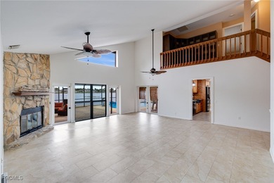 Welcome to a truly rare Cape Coral waterfront estate located on
