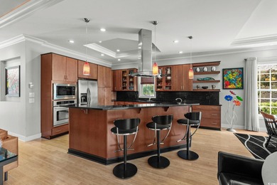 This all-brick custom-built home in the gated community of