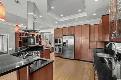 This all-brick custom-built home in the gated community of