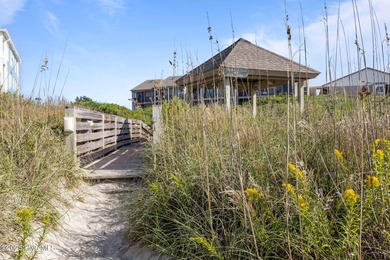 This oceanfront, 1st floor condo is priced just over tax