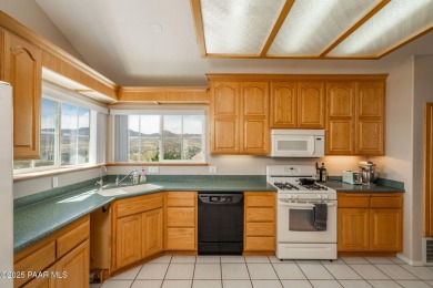 Beautiful split-level ranch perched atop a hill in a serene and