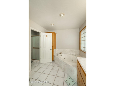 Beautiful split-level ranch perched atop a hill in a serene and