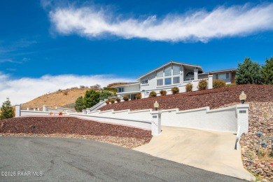 Beautiful split-level ranch perched atop a hill in a serene and