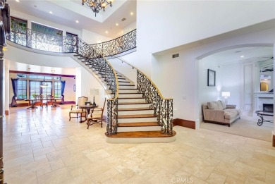 Among the rare custom Westridge Estates perched along the 18th