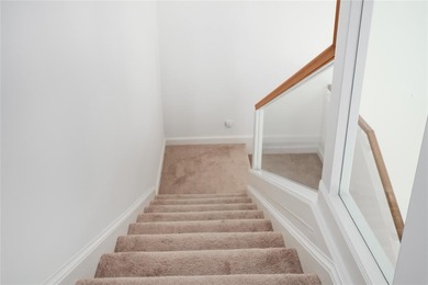 This stunning 3- bedroom,3- bathroom home plus office/den is