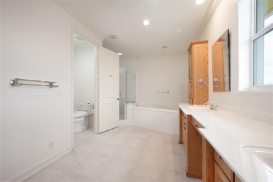 This stunning 3- bedroom,3- bathroom home plus office/den is