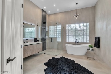 WELCOME TO THIS NEARLY 12,000sqft CUSTOM HOME WITHIN THE GUARD