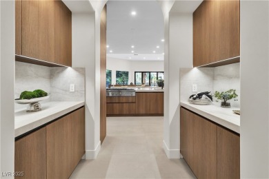 WELCOME TO THIS NEARLY 12,000sqft CUSTOM HOME WITHIN THE GUARD