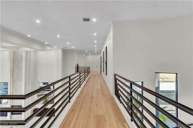 WELCOME TO THIS NEARLY 12,000sqft CUSTOM HOME WITHIN THE GUARD