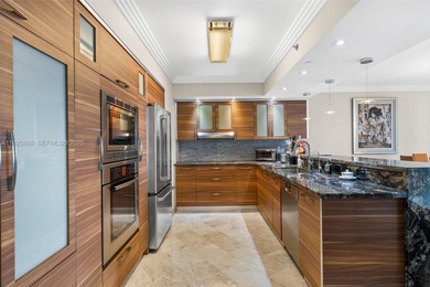 Experience luxurious oceanfront living in this beautifully