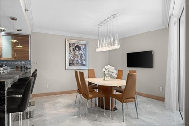 Experience luxurious oceanfront living in this beautifully