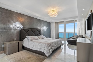 Experience luxurious oceanfront living in this beautifully