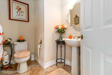 Discover timeless charm in this custom-built lakefront home