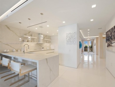 Live the Fisher Island lifestyle in this completely renovated