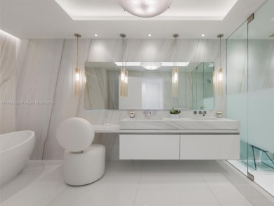 Live the Fisher Island lifestyle in this completely renovated