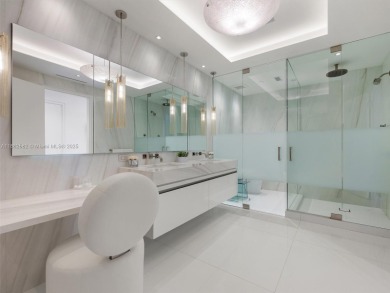 Live the Fisher Island lifestyle in this completely renovated