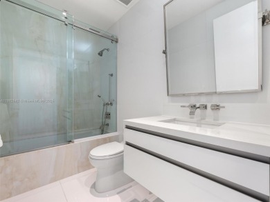 Live the Fisher Island lifestyle in this completely renovated