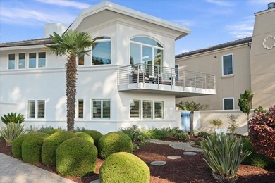 Perched on a spacious corner lot steps from beach access-this