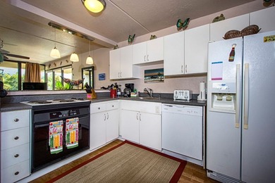 Welcome to Kona Pacific! This fully furnished turn-key top floor