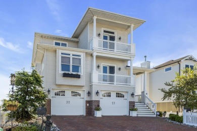 Welcome to your dream home on the bay! This stunning custom