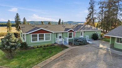 Tucked on nearly five acres in Chattaroy, this 2,800 sq ft home