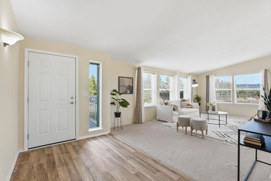 Tucked on nearly five acres in Chattaroy, this 2,800 sq ft home