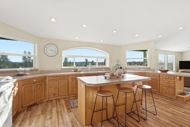 Tucked on nearly five acres in Chattaroy, this 2,800 sq ft home