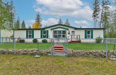 Amazing manufactured home on over 5 acres near Long Lake. This