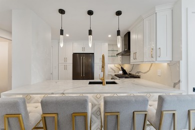 Experience luxury coastal living at its finest in this fully