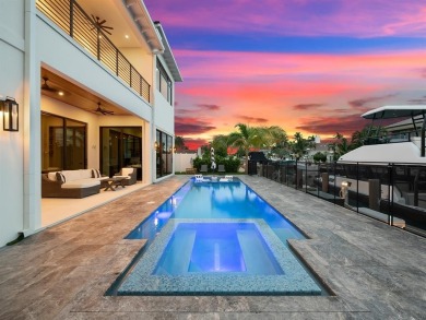 Constructed in 2024, this deepwater estate offers 80' of prime