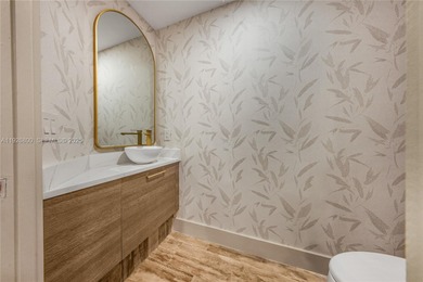 This remarkably renovated residence offers sophisticated living