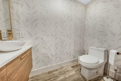 This remarkably renovated residence offers sophisticated living