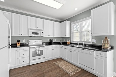 Welcome to coastal luxury living in the highly sought-after