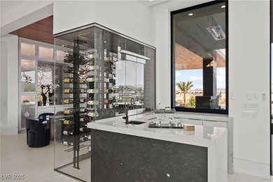 Exquisite lake view custom estate, tucked behind triple gates in