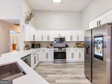 Impeccably updated and ideally situated, this stunning 4-bedroom