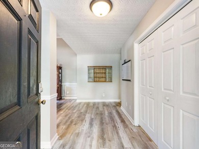 Impeccably updated and ideally situated, this stunning 4-bedroom