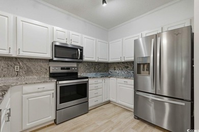 This stunning, designer-furnished first-floor condo features 3