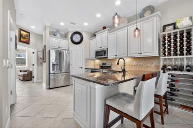 Impeccable coastal Luxury living within this premier gated