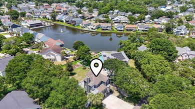 This spacious five-bedroom, four-bathroom raised beach home is