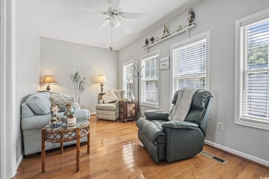 This spacious five-bedroom, four-bathroom raised beach home is