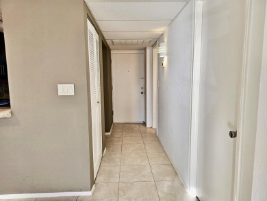 Beautiful 1BR/1.5BA condo with ceramic tile flooring in gated