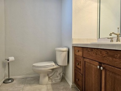 Beautiful 1BR/1.5BA condo with ceramic tile flooring in gated