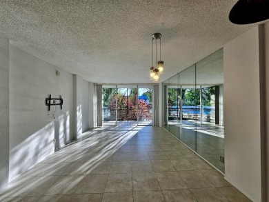 Beautiful 1BR/1.5BA condo with ceramic tile flooring in gated