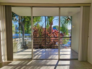 Beautiful 1BR/1.5BA condo with ceramic tile flooring in gated