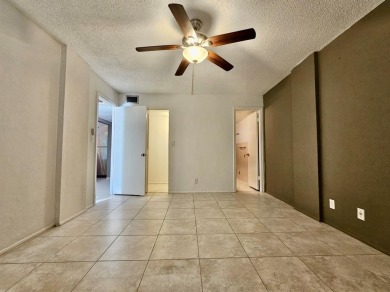 Beautiful 1BR/1.5BA condo with ceramic tile flooring in gated